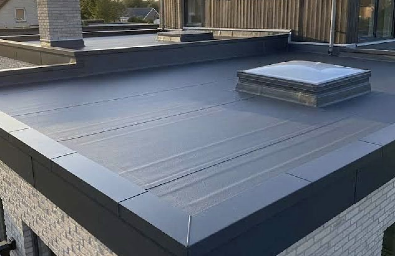 Grey GRP fibreglass flat roof with skylight and metal trim