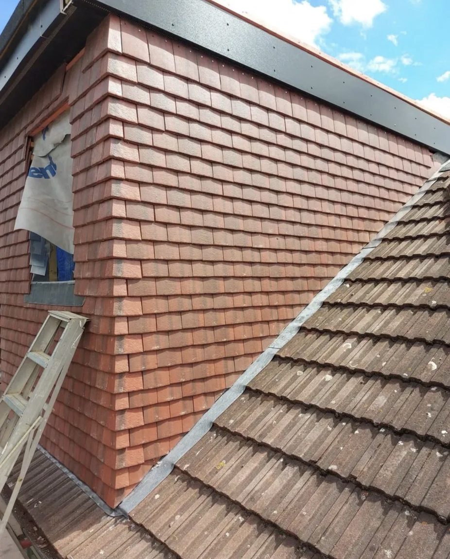 Traditional clay plain-tile hung elevation with lead valley